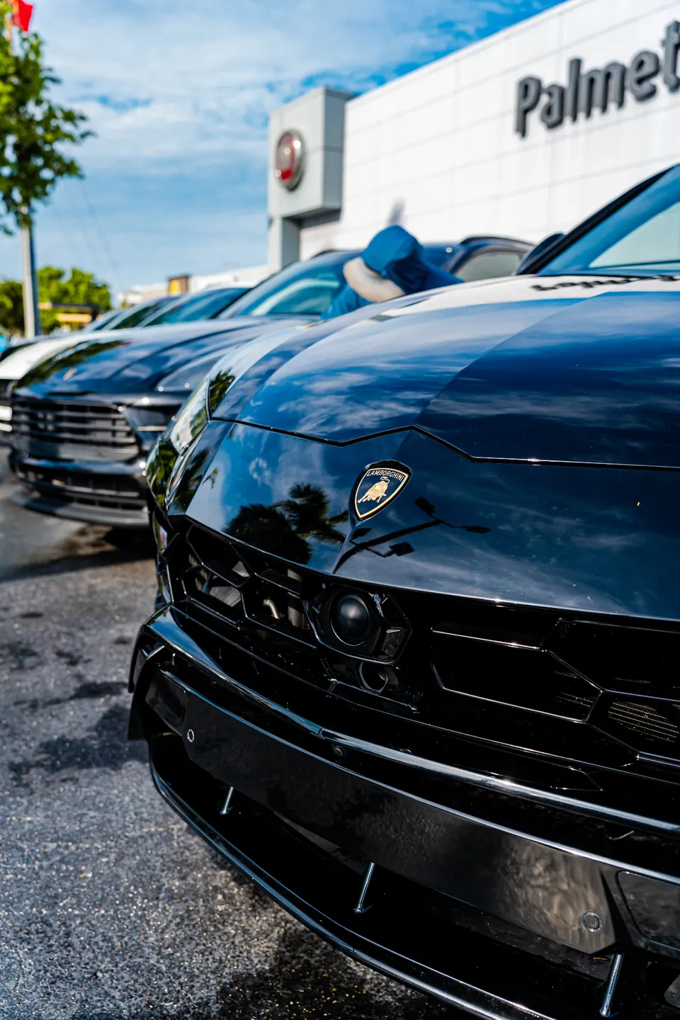 Showroom Dust Free Corp cleaning dealership vehicles in Miami